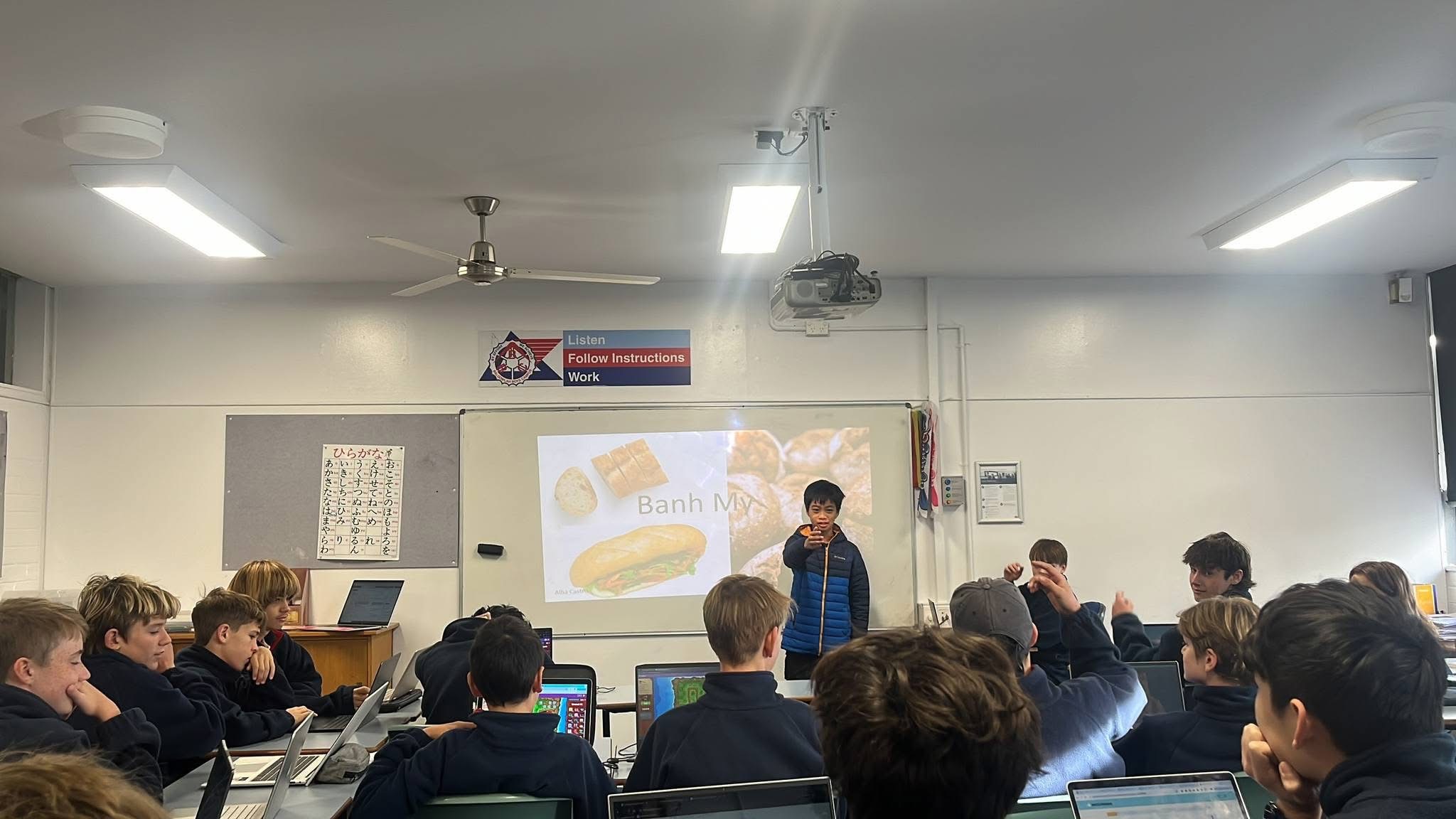 Student presenting Vietnamese culture during a classroom session